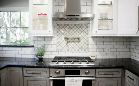 Backsplash White Tile in Kitchen with Stove Range in front